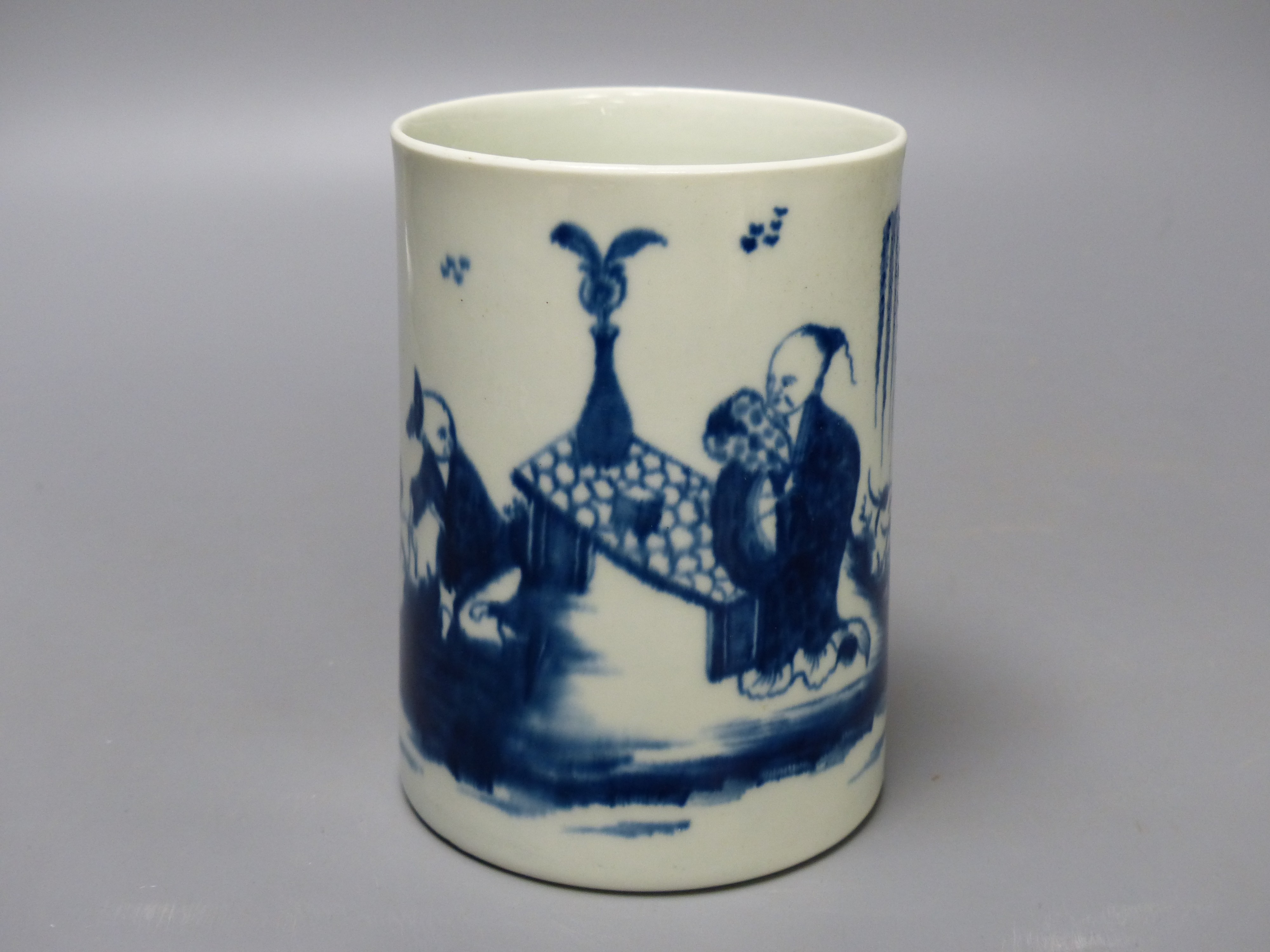 A Worcester 'Gardener' pattern cylinder mug, painted in blue, blue open crescent mark to base. 12.5cm high